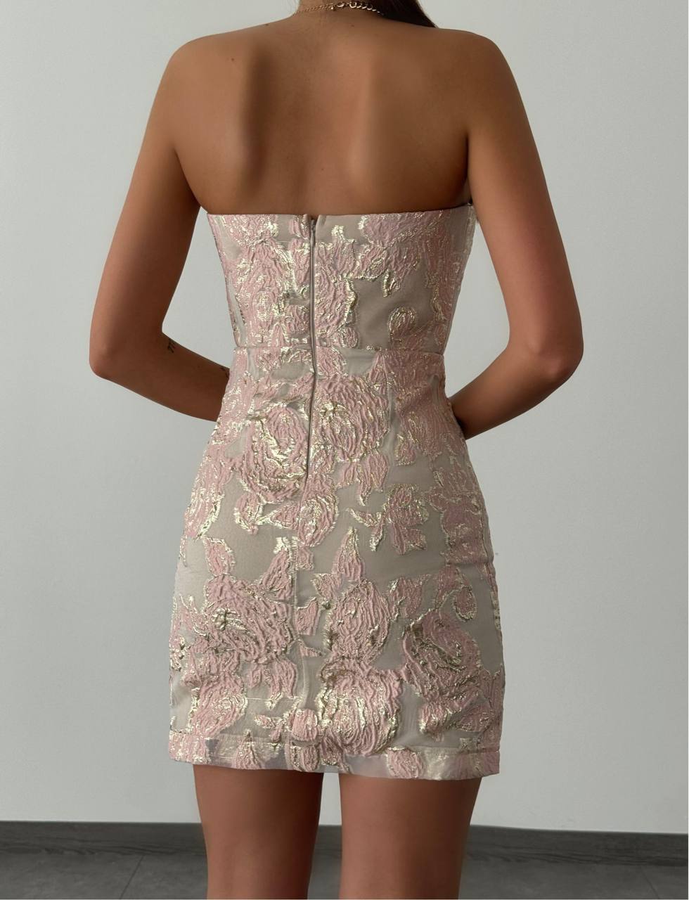 The sensational embroidered short dress is a chic and elegant piece