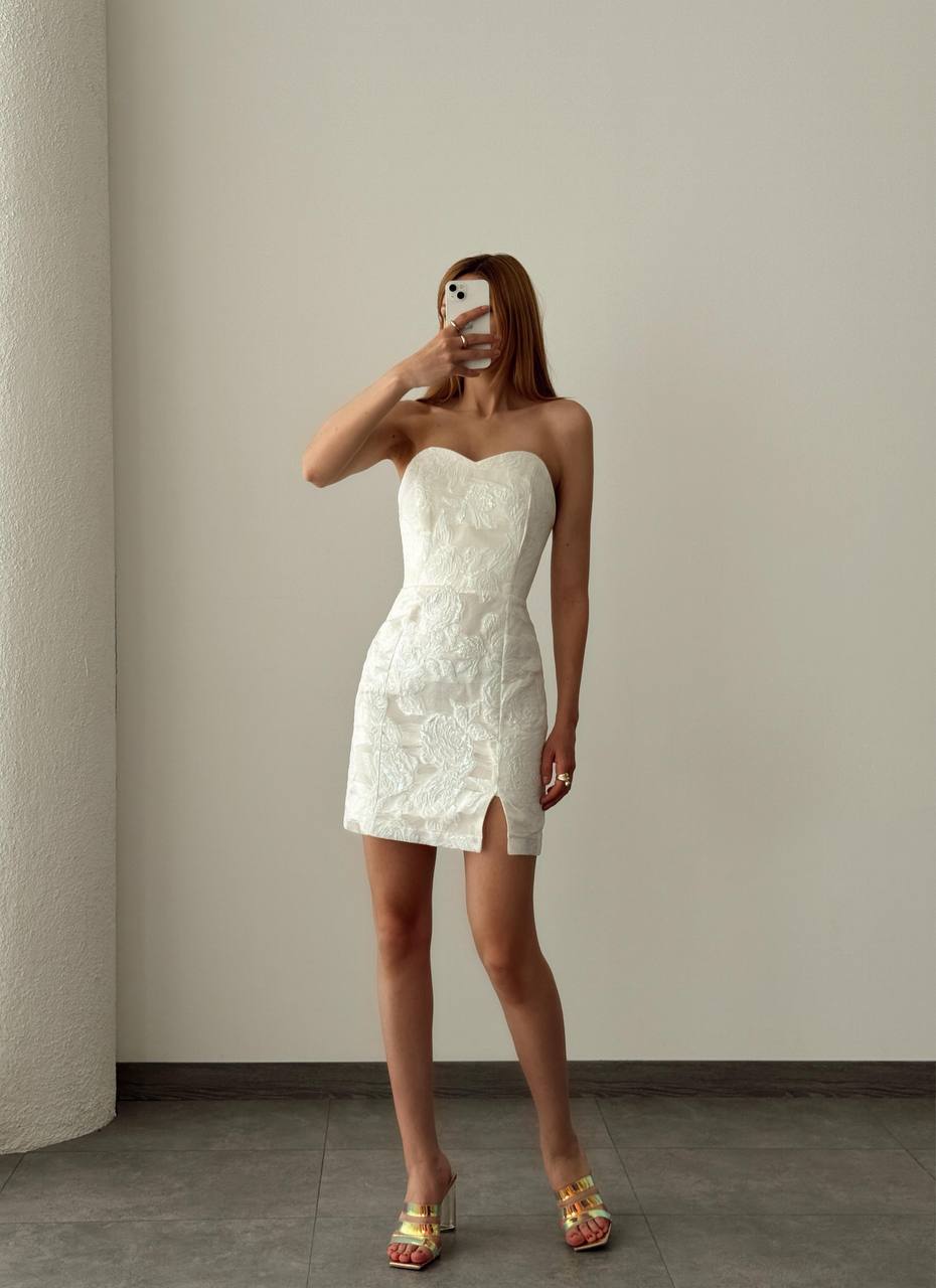 The sensational embroidered short dress is a chic and elegant piece